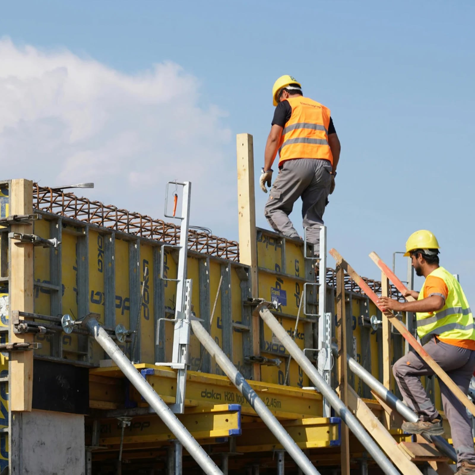 Crew securing formwork on an upper level